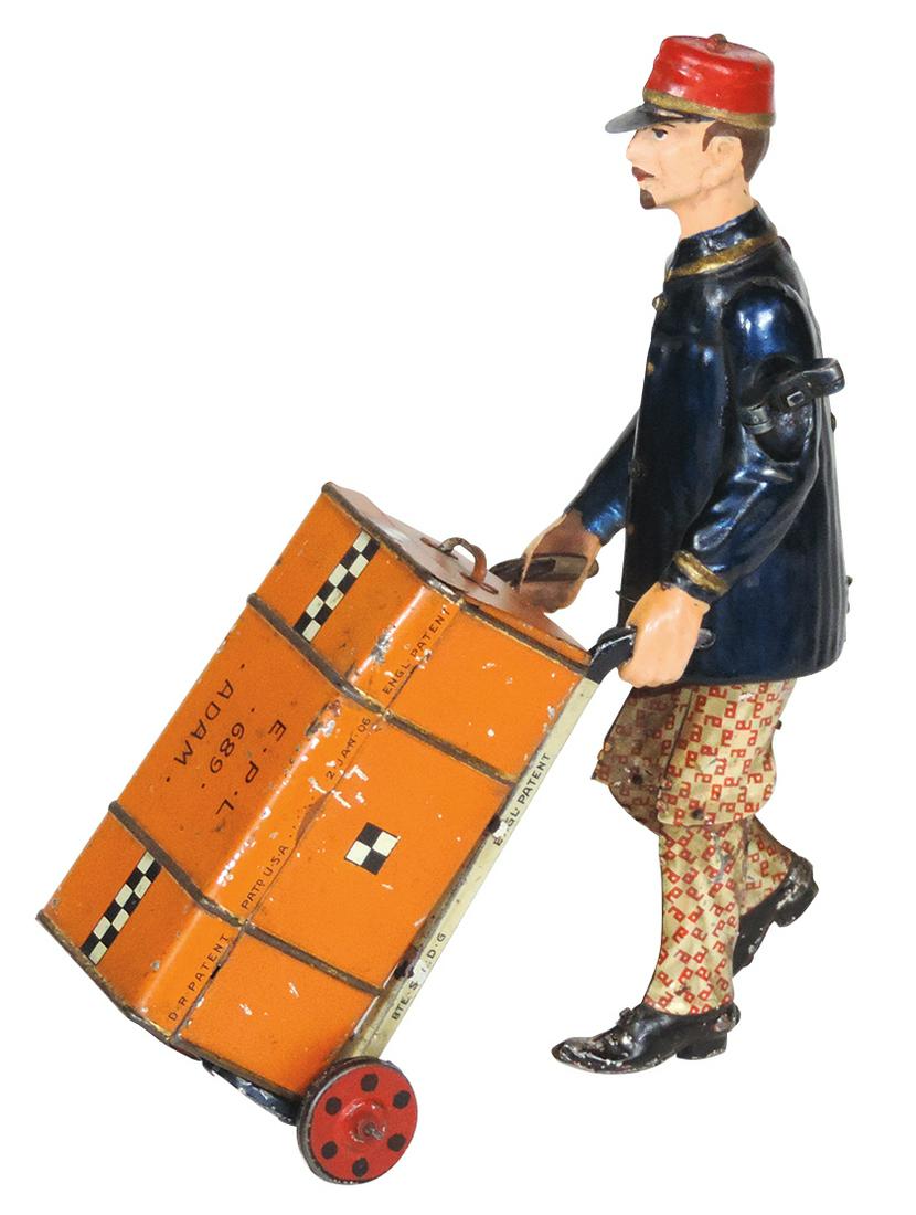 Toy Adam the Porter, Rare, mfgd by Lehmann-Germany,: Toy Adam the Porter, Rare, mfgd by Lehmann-Germany, painted & litho on tin windup walking porter w/removable trunk on cart, clockwork walking action, VG to Exc working cond w/orig finish, 8"H.