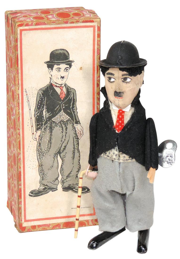 Toy Charlie Chaplin Windup, mfgd by Schuco-Germany,: Toy Charlie Chaplin Windup, mfgd by Schuco-Germany, c.1920s, Rare striped cane version, Near Mint working cond in orig box w/storage wear to edges, 6.5"H.