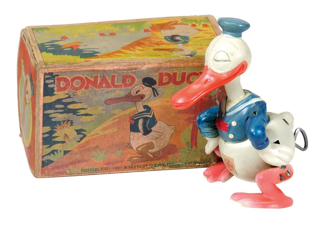 Toy Waddling Donald Duck, Rare pre-war Japan celluloid: Toy Waddling Donald Duck, Rare pre-war Japan celluloid windup in orig box w/Walt Disney paper label & inspection sticker on stomach, VG+ cond noting prof repair at neck, some color touch ups to body &