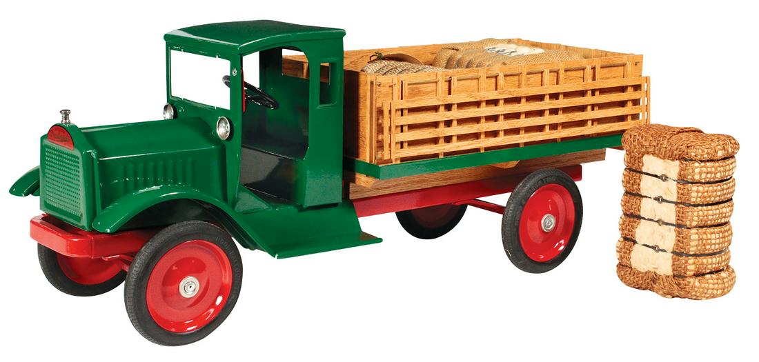 Toy Truck, Keystone Packard Farm Stake Box, pressed: Toy Truck, Keystone Packard Farm Stake Box, pressed steel, c.1925, Exc+ prof restored w/custom oak panel & slat wall box displaying a miniature baled cotton cargo, 25.5"L.