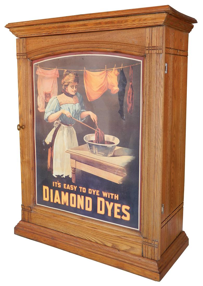 Country Store Dye Cabinet, Diamond Dyes "Washer Woman",: Country Store Dye Cabinet, Diamond Dyes "Washer Woman", c.1910 ash case w/newer litho on tin door panel, sliding doors & back, Exc cond w/some interior wood cubbies missing, 30"H x 23"W x 10"D.