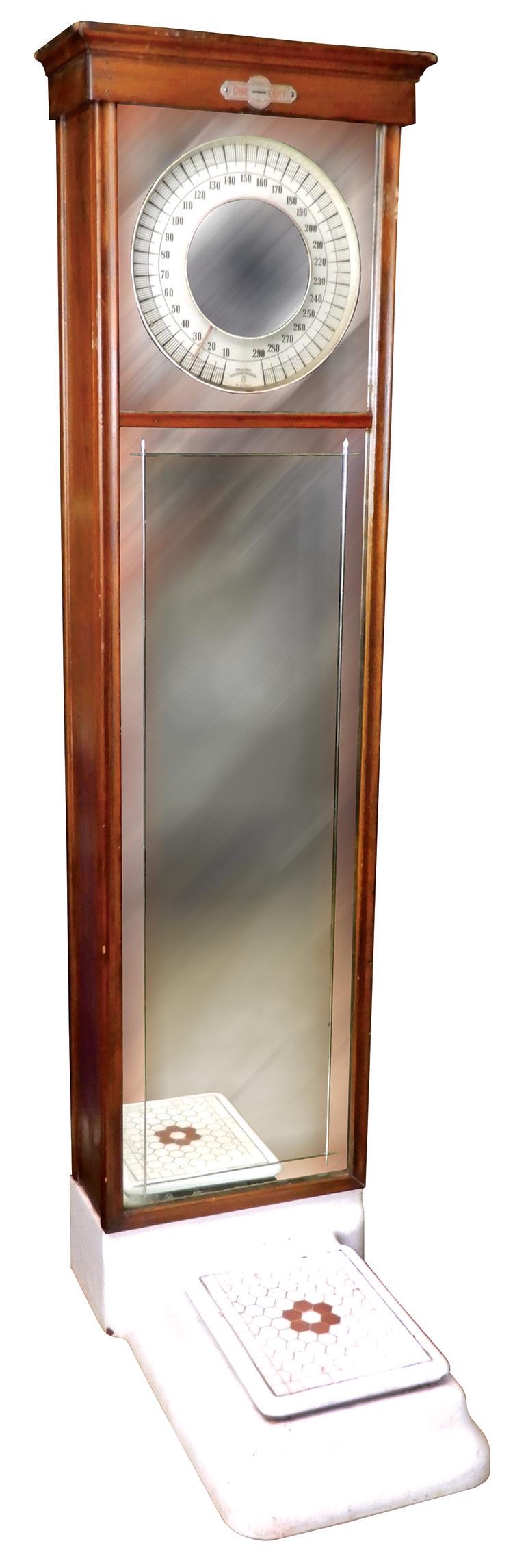 Coin-Operated Scale, Columbia Weighing Machine-NY, 1: Coin-Operated Scale, Columbia Weighing Machine-NY, 1 Cent w/mirror front in birch/poplar cabinet, c.1920s, VG orig working cond, 71"H x 17"W x 28"D.