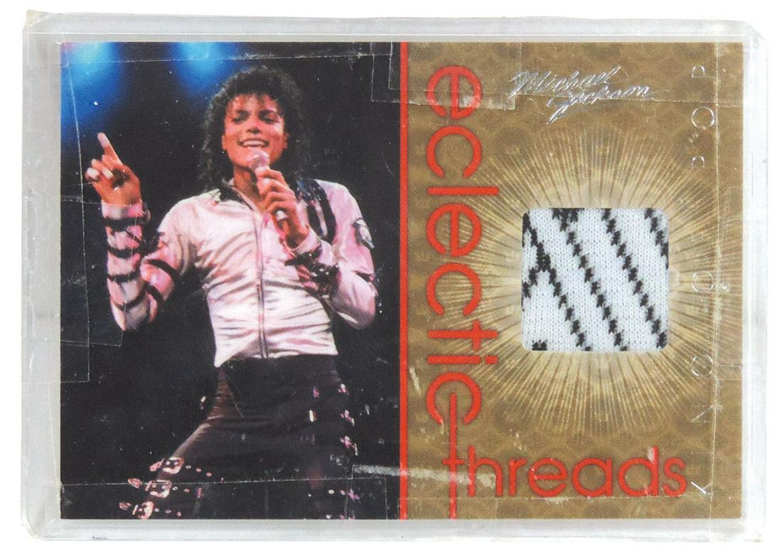 Michael Jackson "Electric Threads" 2011 Panini Trading: Michael Jackson "Electric Threads" 2011 Panini Trading Card, card contains a swatch from a Boyd Clapton designed outfit worn by Jackson in 1971, Near Mint cond, 2.5"H x 3.5"W.