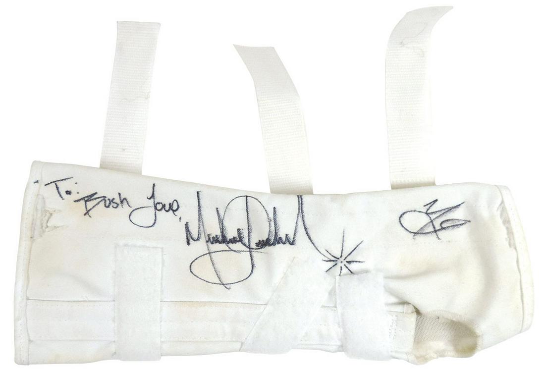 Michael Jackson Stage Worn & Personally Signed Arm: Michael Jackson Stage Worn & Personally Signed Arm Brace, Dangerous Tour 1992/93, inscribed & signed across lower forearm "To: Bush Love Michael Jackson" & initialed "MJ", VG+ cond w/signs of soiling,
