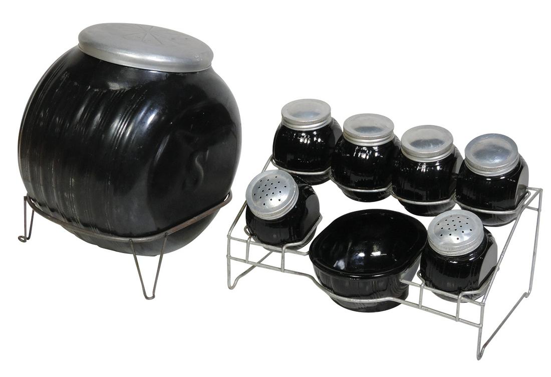 Kitchenware (8), complete set of Sellers kitchen glass canister jars in black glass, painted black: Kitchenware (8), complete set of Sellers kitchen glass canister jars in black glass, painted black flour w/embossed S, black amethyst S&P, salt dip & 4 spice jars in orig wire stands, VG cond w/signs