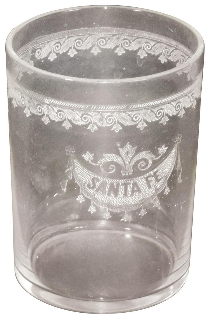 Railroad Santa Fe etched glass tumbler, draped festoon logo under scrolling border, VG+ cond: Railroad Santa Fe etched glass tumbler, draped festoon logo under scrolling border, VG+ cond w/ground flea bite nick on rim, 3.75"H.