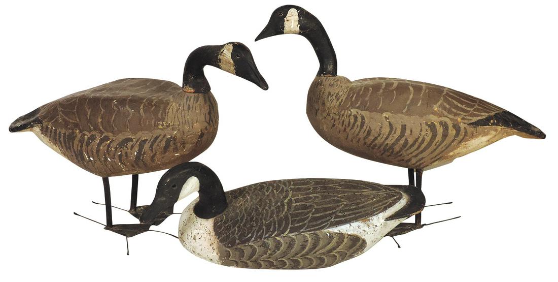 Decoys (3), Canadian Geese carved wood & cork floater & 2 full-bodied wood & papier mache' Standing: Decoys (3), Canadian Geese carved wood & cork floater & 2 full-bodied wood & papier mache' Standing Geese w/glass eyes on metal legs & feet, VG cond w/various amounts of wear, largest 20"H x 30"L.