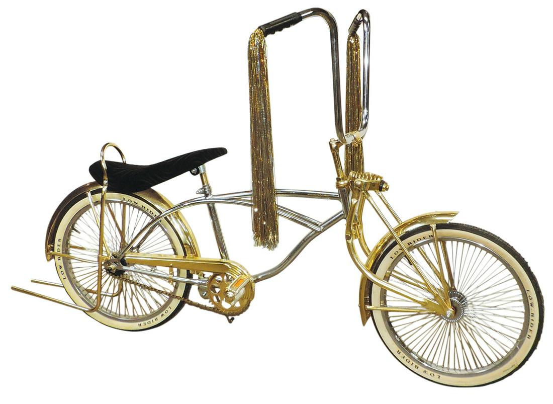 Bicycle, Low Rider, chrome frame, 20" wheels w/gold plated fork, fenders, chain guard & wheelie: Bicycle, Low Rider, chrome frame, 20" wheels w/gold plated fork, fenders, chain guard & wheelie bars, banana seat & high rise handles w/tassels, Exc cond, 43"H x 68"L.
