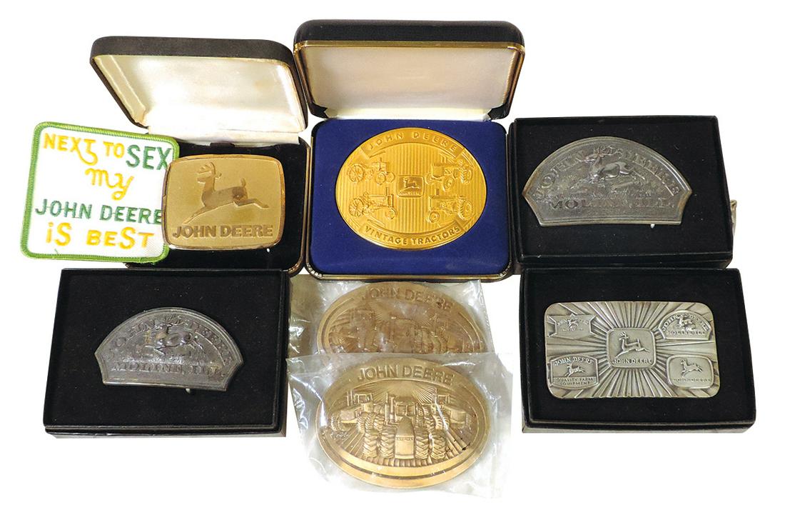 John Deere Belt Buckles (7), Limited Edition 1992 "Two-Cylinder Tractors" #1795/6000, two 1876 logo: John Deere Belt Buckles (7), Limited Edition 1992 "Two-Cylinder Tractors" #1795/6000, two 1876 logo silverplate, historical trademarks, two 1981 oval & modern trademark, Exc cond w/5 in boxes, largest