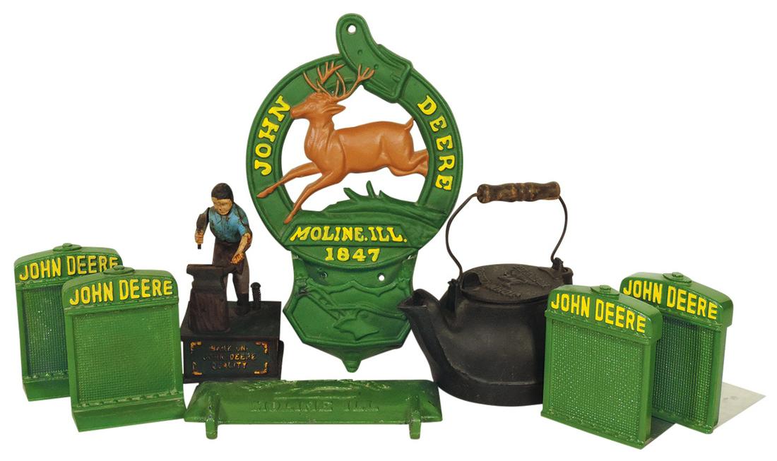 John Deere Memorabilia (8), all cast iron: 2 pr radiator bookends, later letter holder, teakettle,: John Deere Memorabilia (8), all cast iron: 2 pr radiator bookends, later letter holder, teakettle, blacksmith mechanical bank & vintage seed cover Z412-H, VG & Exc cond, largest 13"H.