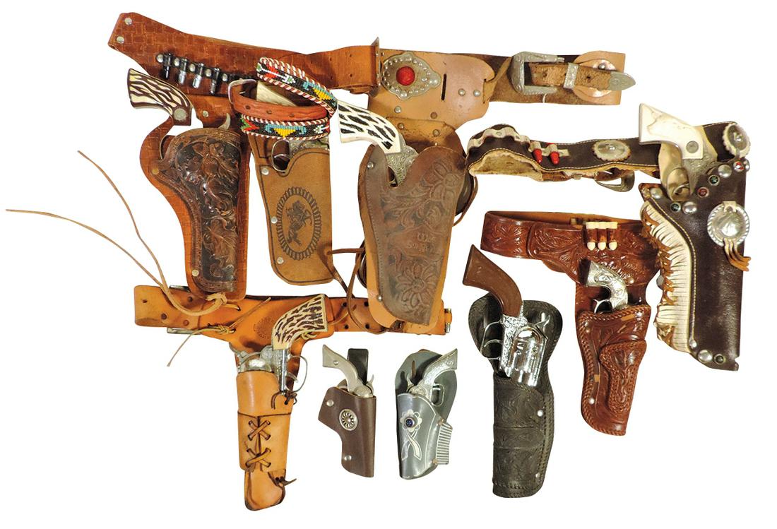 Western Character Cap Guns & Holsters (18), all single sets with & w/o belts, matched Shootin' Shell: Western Character Cap Guns & Holsters (18), all single sets with & w/o belts, matched Shootin' Shell Fanner by Mattel w/orig leather belt, Marshall w/acorn embossed holster, Hubley Texan Jr w/brown & 