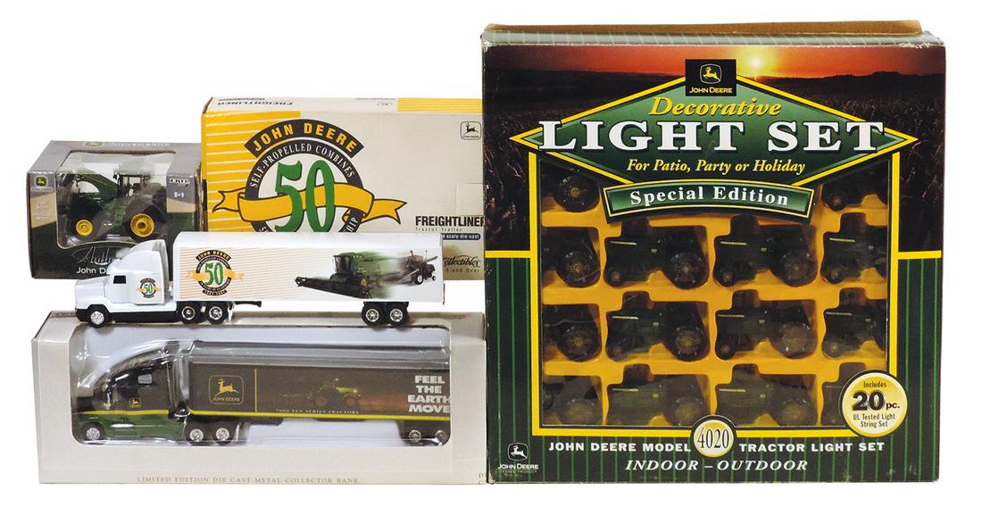 Toy John Deere Tractors (4), New in Box 4020 Light Set, 50th Anniversary Freightliner: Toy John Deere Tractors (4), New in Box 4020 Light Set, 50th Anniversary Freightliner tractor/trailer, 8530 by Ertl & Freightliner C120 by SpecCast, all Mint in Box cond, largest 14"Sq.