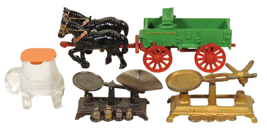 Toys (4), Arcade McCormick Deering cast iron wagon & horses (wagon & gear repainted, horses orig),: Toys (4), Arcade McCormick Deering cast iron wagon & horses (wagon & gear repainted, horses orig), 2 cast iron toy balance scales (1 w/o weights) & Elephant glass candy container, VG to Exc cond unles