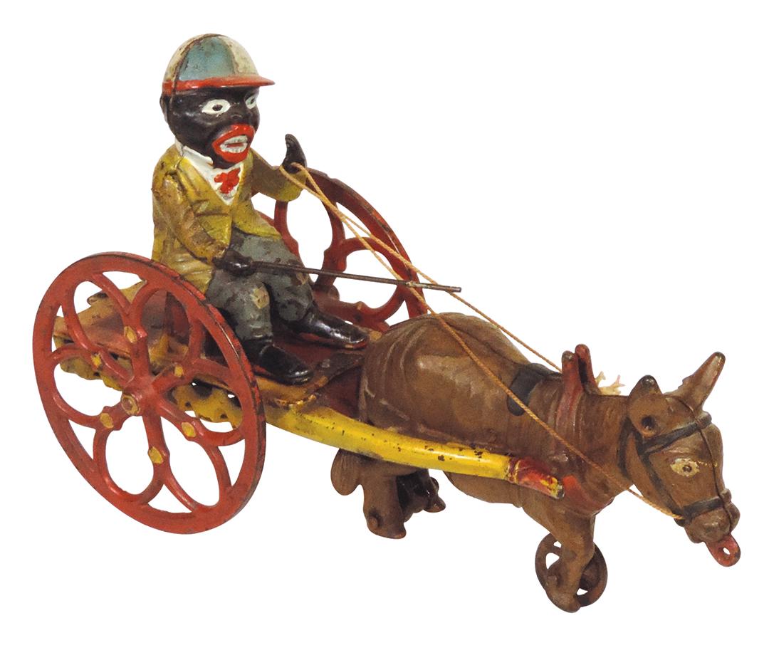 Black Americana Pull Toy, cast iron jockey, mfgd by J & E Stevens, Exc working cond w/orig paint,: Black Americana Pull Toy, cast iron jockey, mfgd by J & E Stevens, Exc working cond w/orig paint, some wear & scattered nicks, 9"L.