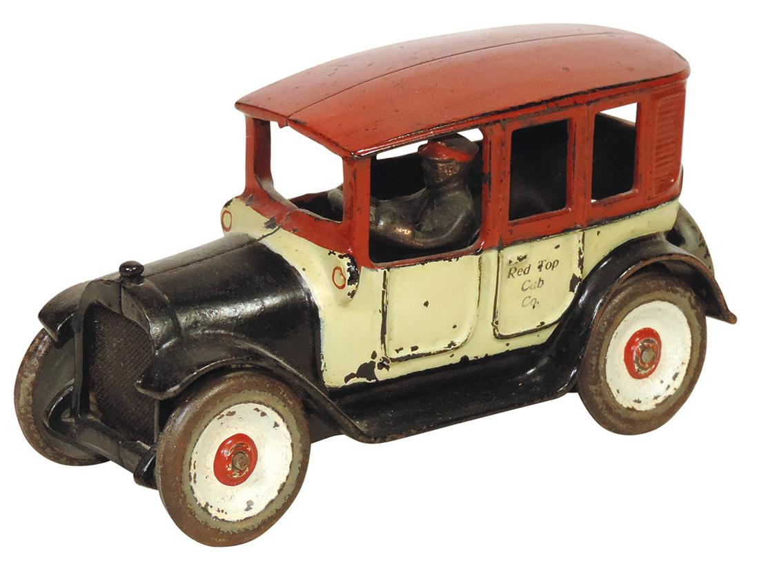 Toy Car, Red Top Cab Co., cast iron, mfgd by Arcade in 3-tone paint w/driver, Exc cond & orig paint: Toy Car, Red Top Cab Co., cast iron, mfgd by Arcade in 3-tone paint w/driver, Exc cond & orig paint w/scattered nicks & flakes, 8"L.