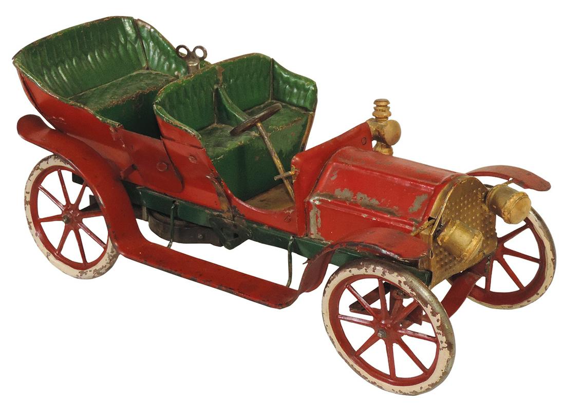 Toy Open Touring Car, clockwork, pre-war Germany painted tin w/embossed seat & steerable wheels,: Toy Open Touring Car, clockwork, pre-war Germany painted tin w/embossed seat & steerable wheels, Good+ cond w/paint wear, missing side lamp & broken drive spring, 15.5"L.