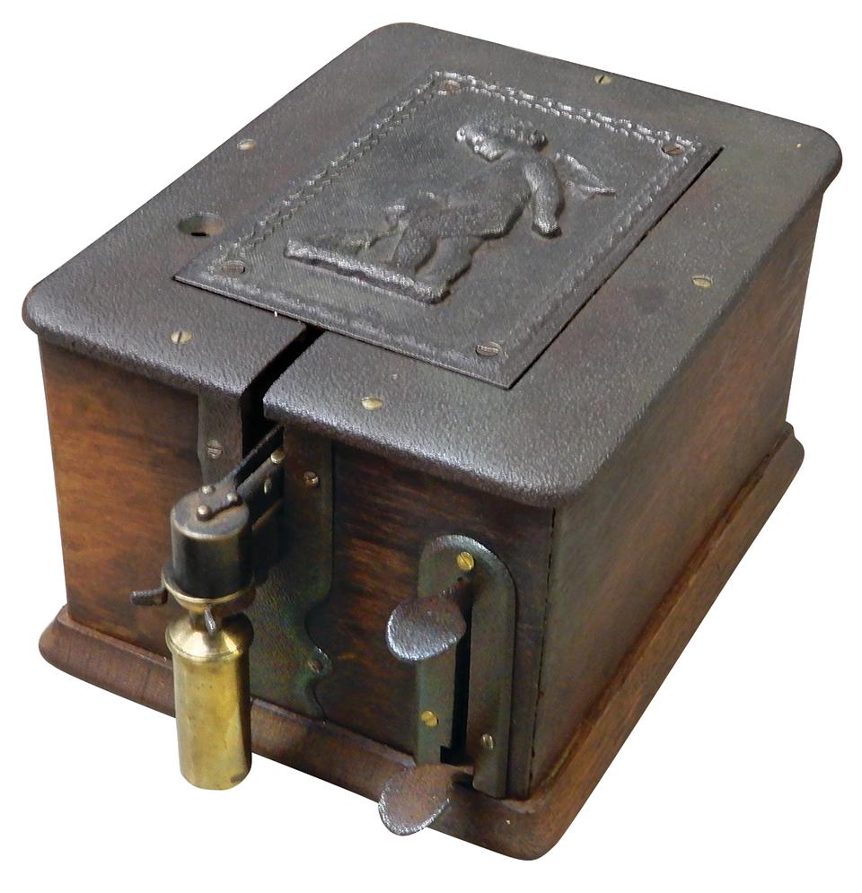 Cigar Cutter w/Electric/Gas Lighter, cast iron w/oak cabinet mfgd by Abbot Electric, embossed cupid: Cigar Cutter w/Electric/Gas Lighter, cast iron w/oak cabinet mfgd by Abbot Electric, embossed cupid on top, c.1900, Good mechanical working cond, needs electric power, comes w/copy of patent drawings,