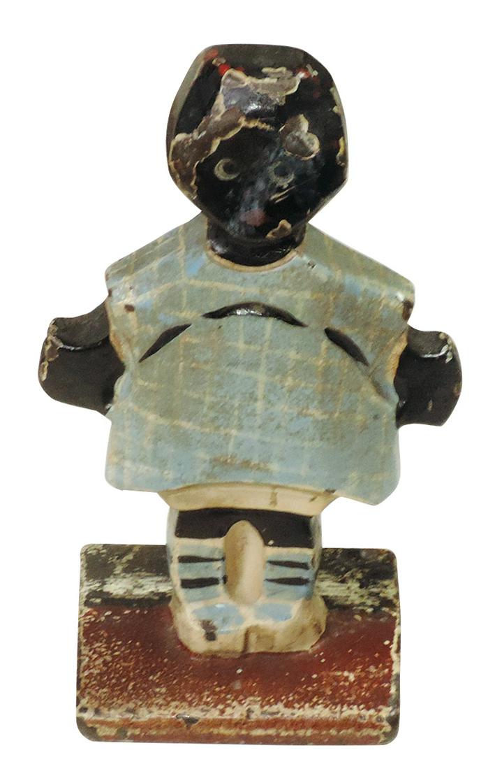Doorstop, Topsy, polychrome cast iron figure of Black girl w/wedge base, mfgd by Hubley, VG cond: Doorstop, Topsy, polychrome cast iron figure of Black girl w/wedge base, mfgd by Hubley, VG cond w/orig paint, 6"H.