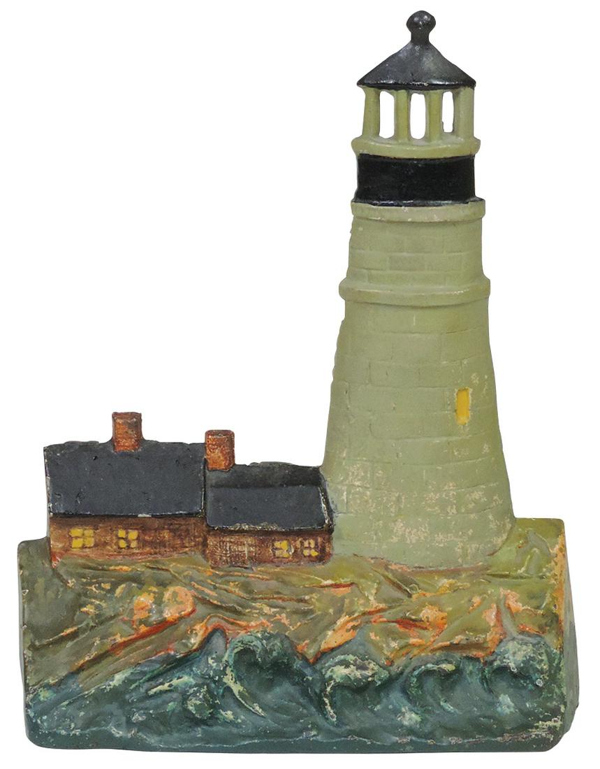 Doorstop, Lighthouse of Gloucester 1925, mfgd by A.M. Greenblatt Studios, polychrome cast iron w/2: Doorstop, Lighthouse of Gloucester 1925, mfgd by A.M. Greenblatt Studios, polychrome cast iron w/2 houses, embossed inscription on verso, Exc+ cond w/orig paint, 9.25"H x 11.5"W.