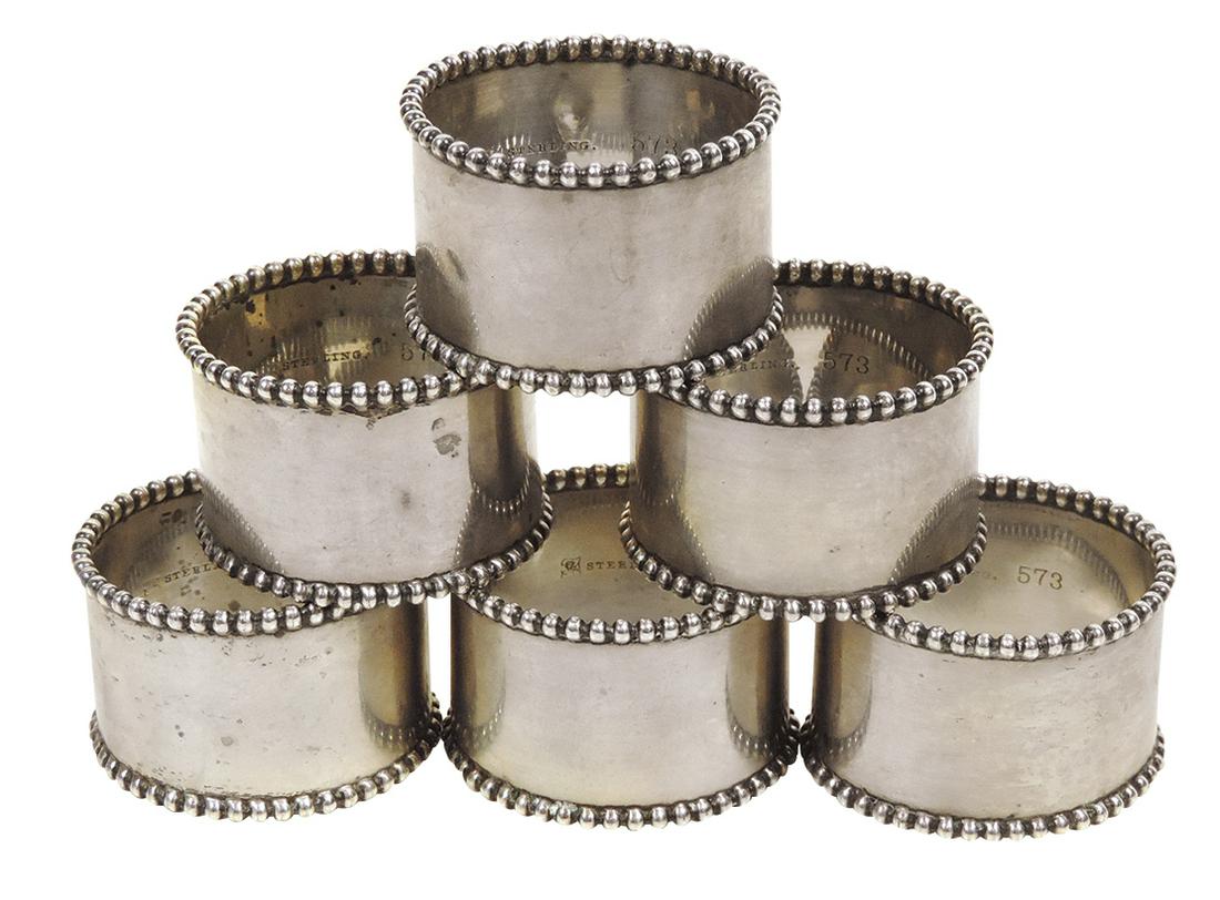 Sterling Silver Napkins Rings (6), matching set w/beaded edges, impressed Sterling 573 on interior,: Sterling Silver Napkins Rings (6), matching set w/beaded edges, impressed Sterling 573 on interior, 2 w/small dents, others in Exc cond, 1 1/8"H x 1 3/4"Dia.