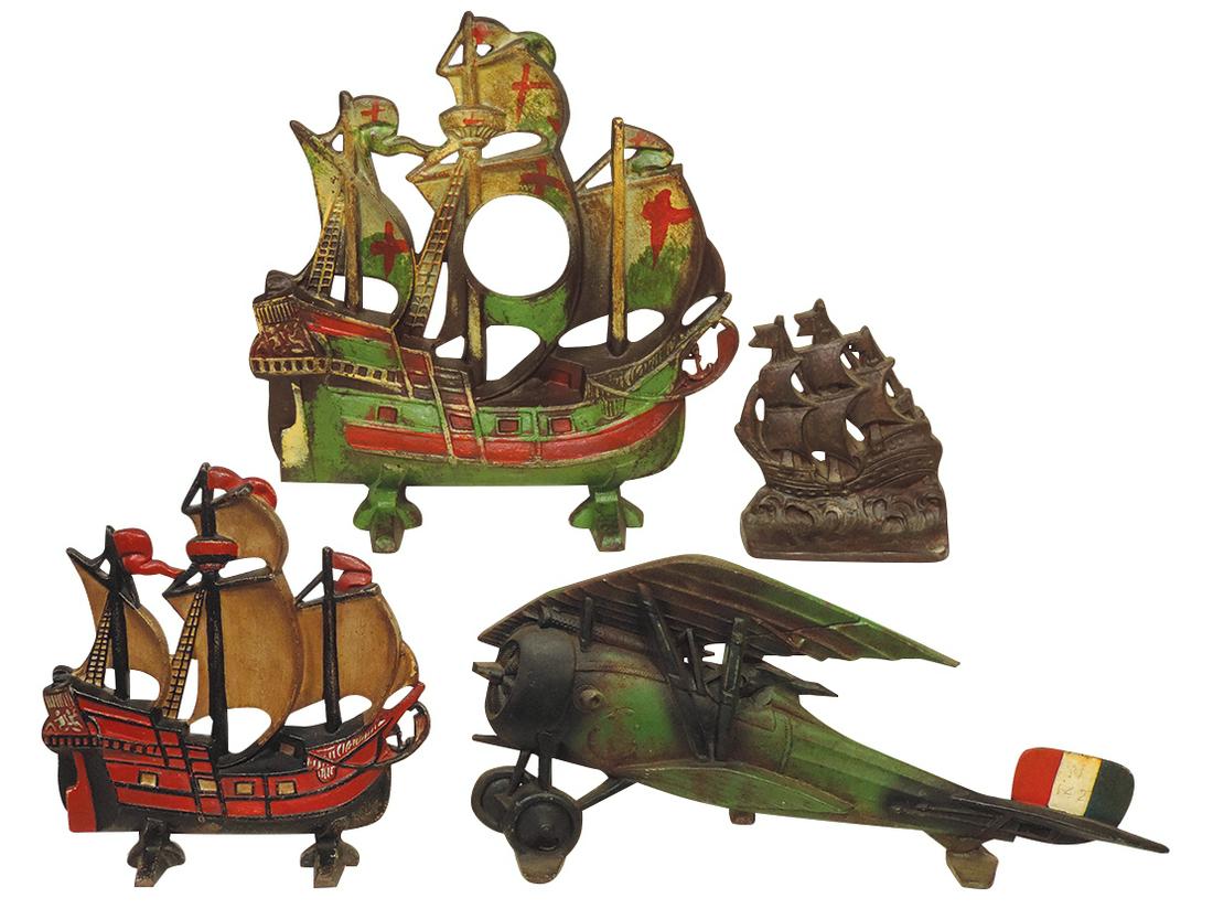 Doorstops (4), Large WWI airplane marked CN, 2 Large Sailing Ships (1 repainted) & ship: Doorstops (4), Large WWI airplane marked CN, 2 Large Sailing Ships (1 repainted) & ship bookend/doorstop, all cast iron, VG cond, largest 19.5"L.