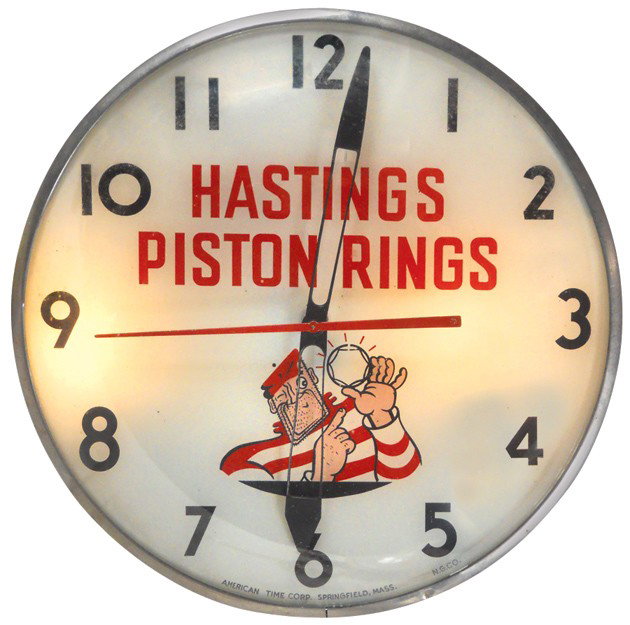 Hastings Piston Rings light-up clock, mfgd by Ameri: Hastings Piston Rings light-up clock, mfgd by American Time Corp., VG working cond, 16"Dia.
