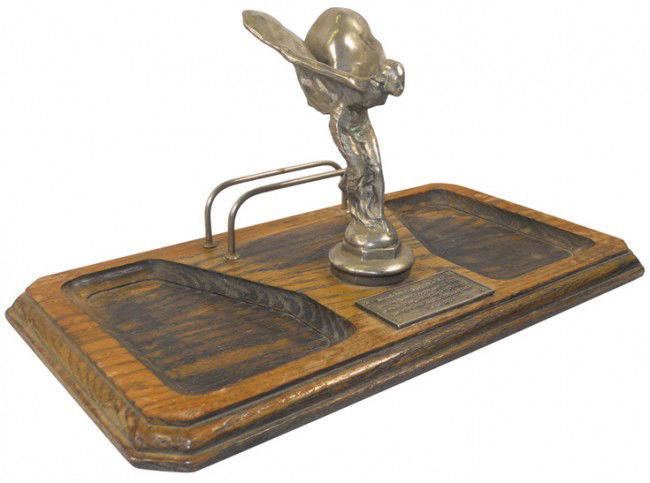 Rolls Royce "Flying Lady" prototype replica on des: Rolls Royce "Flying Lady" prototype replica on desk letter holder, the originals were used on the Silver Ghost cars of the 1920's, VG cond, 7"H x 16"W.