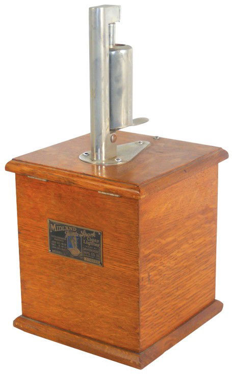 Cigar lighter, Midland Jump Spark, Model L, c.192: Cigar lighter, Midland Jump Spark, Model L, c.1920, oak case w/orig maker's tag, Exc working cond, missing cap to fuel tank, 15.5"H x 7"Sq.