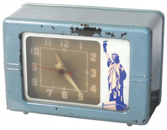 Statue of Liberty light-up clock, mfgd by Lackner: Statue of Liberty light-up clock, mfgd by Lackner, VG working cond w/paint wear, 5.5"H x 7.5"W.