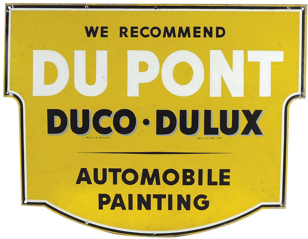 Sign, DuPont Duco-Dulex Automobile Painting, diecut metal shield, Good+ cond w/some overall spotting: Sign, DuPont Duco-Dulux Automobile Painting, diecut metal shield, Good+ cond w/some overall spotting & soft bend upper left, 28.5"H x 36"W.