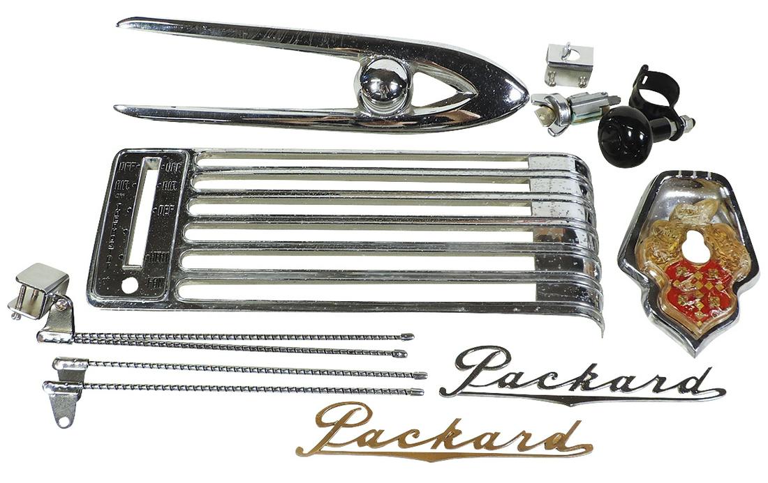 Packard parts (9), 1953 trunk emblem w/chrome bezel, 2 script emblems, NOS ignition lock w/key, 1956 (1 of 1)