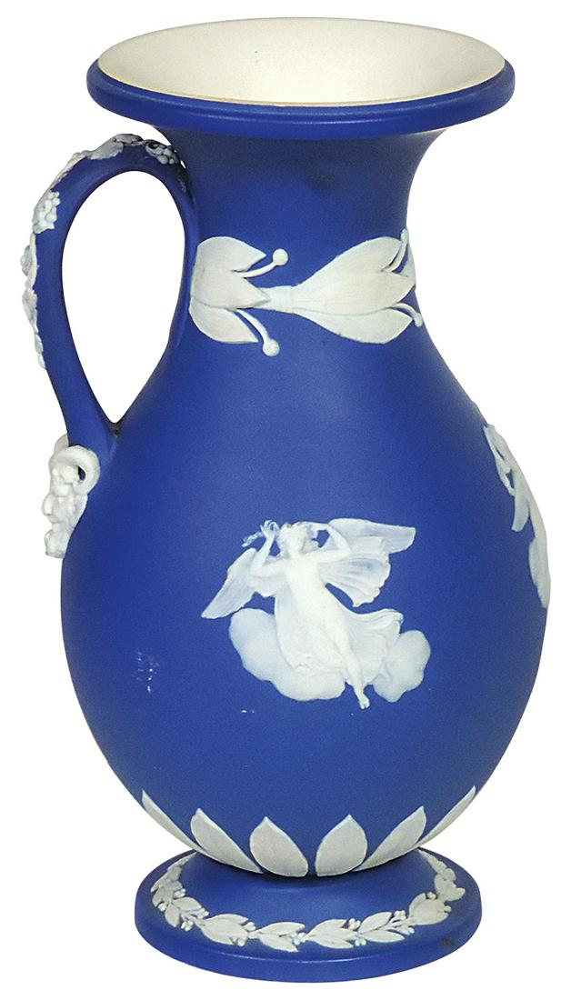 Porcelain, Wedgwood Jasperware handled flask, blue dip w/angels & Satyr mask on bolted socle base,: Porcelain, Wedgwood Jasperware handled flask, blue dip w/angels & Satyr mask on bolted socle base, dated 1884, VG+ cond w/some minor flea bite nicks, 9"H.