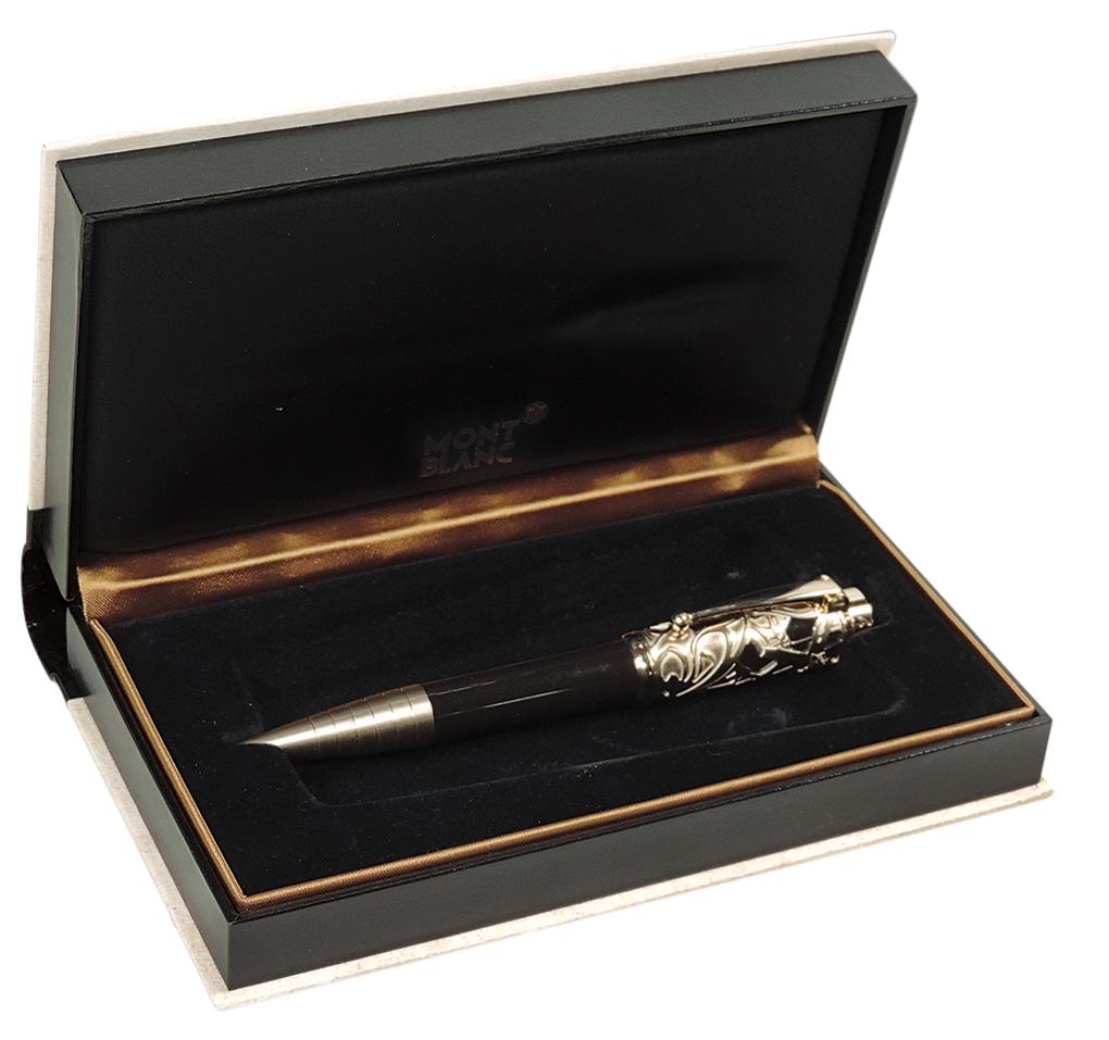 Ballpoint Pen, Montblanc Carlo Collodi Limited Edition, in honor of the brilliant children's book: Ballpoint Pen, Montblanc Carlo Collodi Limited Edition, in honor of the brilliant children's book author & creator of Pinocchio, dark-brown resin crowned w/a skeletonized cap overlay, champagne-tone g