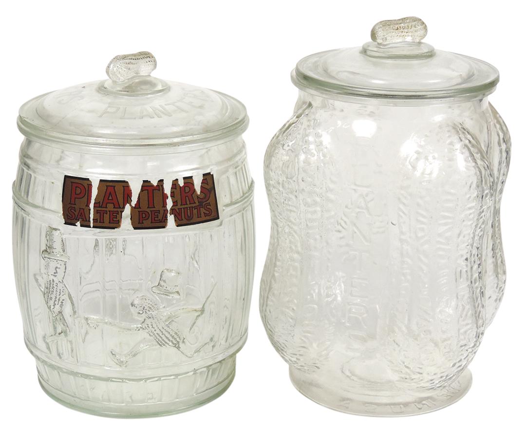 Country Store Jars (2), Planters Peanut barrel glass jar w/running Mr. Peanut & blown-out embossed: Country Store Jars (2), Planters Peanut barrel glass jar w/running Mr. Peanut & blown-out embossed peanut, 1st w/label remnant & few small chips, 2nd Exc cond, larger 14"H.