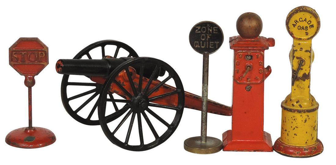 Toy Cannon, Gas Pumps & Road Signs (5), cast iron, early cannon w/spoked wheels, 2 Arcade gas pumps: Toy Cannon, Gas Pumps & Road Signs (5), cast iron, early cannon w/spoked wheels, 2 Arcade gas pumps & 2 road signs, VG cond, largest 9.75"L.