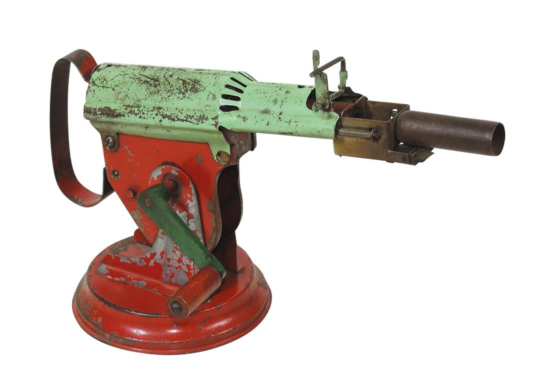 Toy Paper Buster Cannon, pressed steel crank-operated automatic, mfgd by Langson, c.1920s, on: Toy Paper Buster Cannon, pressed steel crank-operated automatic, mfgd by Langson, c.1920s, on compound stand, Good+ working cond, 12.5"L.