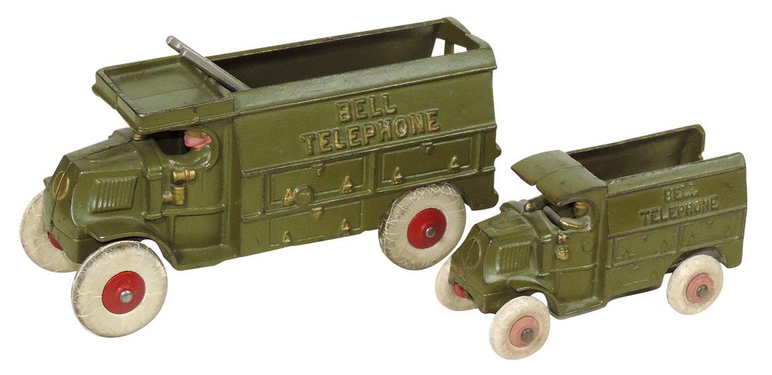 Toy Bell Telephone Trucks (2), cast iron medium & small sizes, mfgd by Hubley, Exc cond w/orig: Toy Bell Telephone Trucks (2), cast iron medium & small sizes, mfgd by Hubley, Exc cond w/orig tires, larger 8"L.