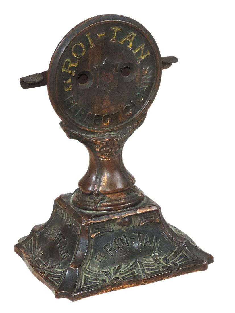 Cigar Advertising Cutter, Roi-Tan, cast metal w/splashed bronze finish & levered blades w/nip: Cigar Advertising Cutter, Roi-Tan, cast metal w/splashed bronze finish & levered blades w/nip receptacle in base, Good+ working cond, 8"H.
