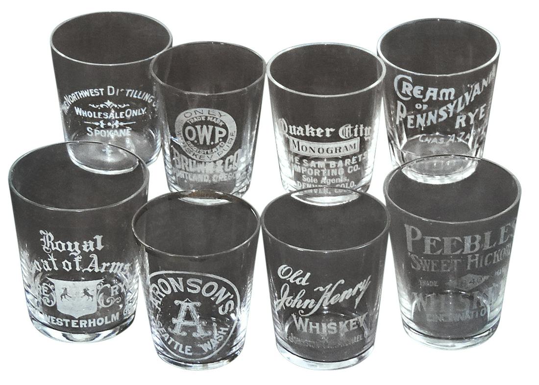 Advertising Shot Glasses (8), Pre-Prohibition, etched glass, Northwest Distilling (Spokane), Brunn &: Advertising Shot Glasses (8), Pre-Prohibition, etched glass, Northwest Distilling (Spokane), Brunn & Co. (Portland), Quaker City Monogram (Denver), Aronson's (Seattle) & Peebles (Cincinnati) plus Old 