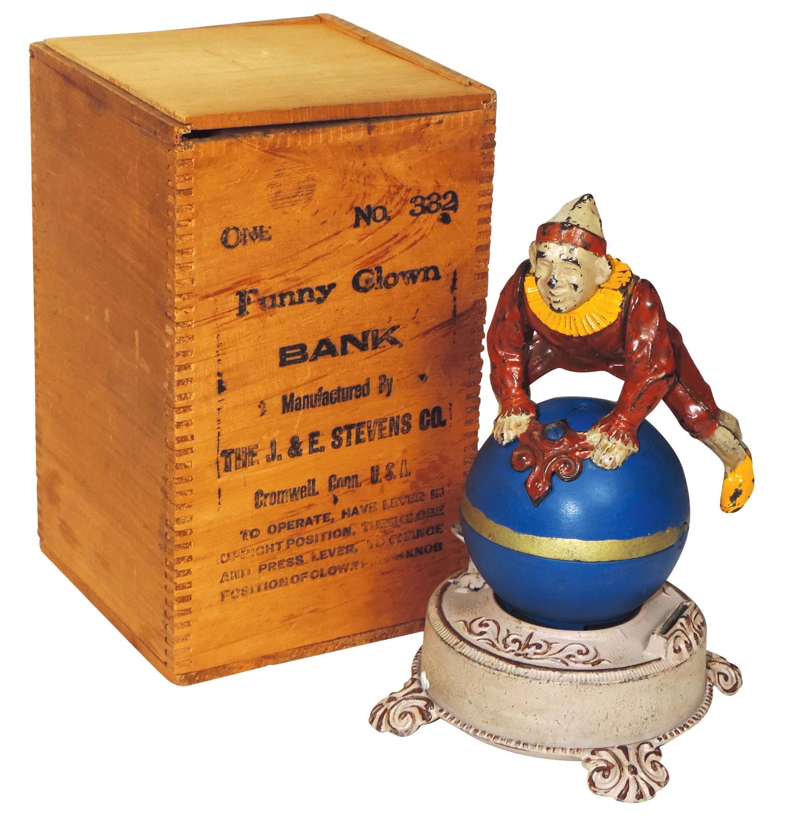 Mechanical Bank, Clown on Globe w/orig wood box, J. & E. Stevens Co.-Cromwell, CT, c.1870: Mechanical Bank, Clown on Globe w/orig wood box, J. & E. Stevens Co.-Cromwell, CT, c.1870, patd 423450 7 Pendg, cast iron, areas of repaint, spins but doesn't do handstand,o/wise VG cond 9.25"H, box E
