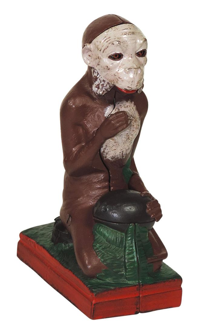 Mechanical Bank, Monkey & Coconut, J. E. Stevens Co.-Cromwell CT, pat. February 2, 1875, cast iron,: Mechanical Bank, Monkey & Coconut, J. & E. Stevens Co.-Cromwell CT, pat. February 2, 1875, cast iron, all parts present but not currently operable, VG cond w/some repaint, 8"H.