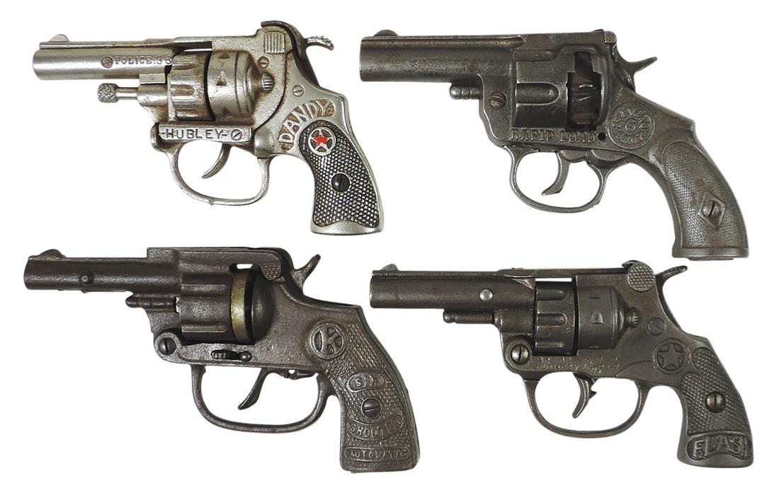 Toy Cap Guns (4), cast iron rapid fire revolvers, Stevens 6 shot rapid load, Hubley Dandy & Flash: Toy Cap Guns (4), cast iron rapid fire revolvers, Stevens 6 shot rapid load, Hubley Dandy & Flash plus Kenton Six Shooter, VG cond or better w/all but 1st working, largest 7.25"L.