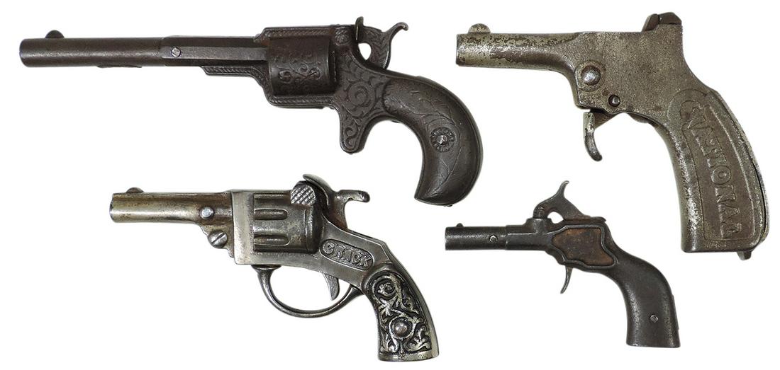 Toy Cap Pistols (4), cast iron, mfgd by National, all different, 3 single shot & snap back roll: Toy Cap Pistols (4), cast iron, mfgd by National, all different, 3 single shot & snap back roll shooter, Good+ to VG working cond, largest 7.5"L.