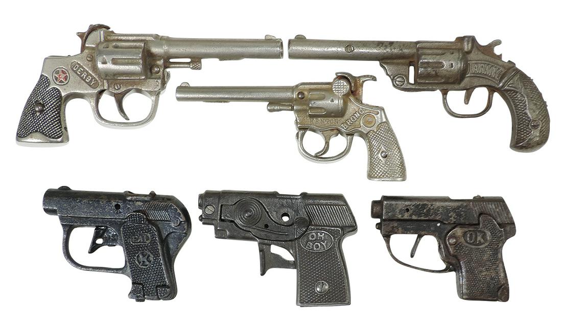 Toy Cap Guns (6), cast iron, Hubley Derby, Kilgore Oh-Boy & Pal, Kenton Bronco, unknown OK &: Toy Cap Guns (6), cast iron, Hubley Derby, Kilgore Oh-Boy & Pal, Kenton Bronco, unknown OK & Army, Good+ to VG working cond, largest 7.75"L (Kilgore).