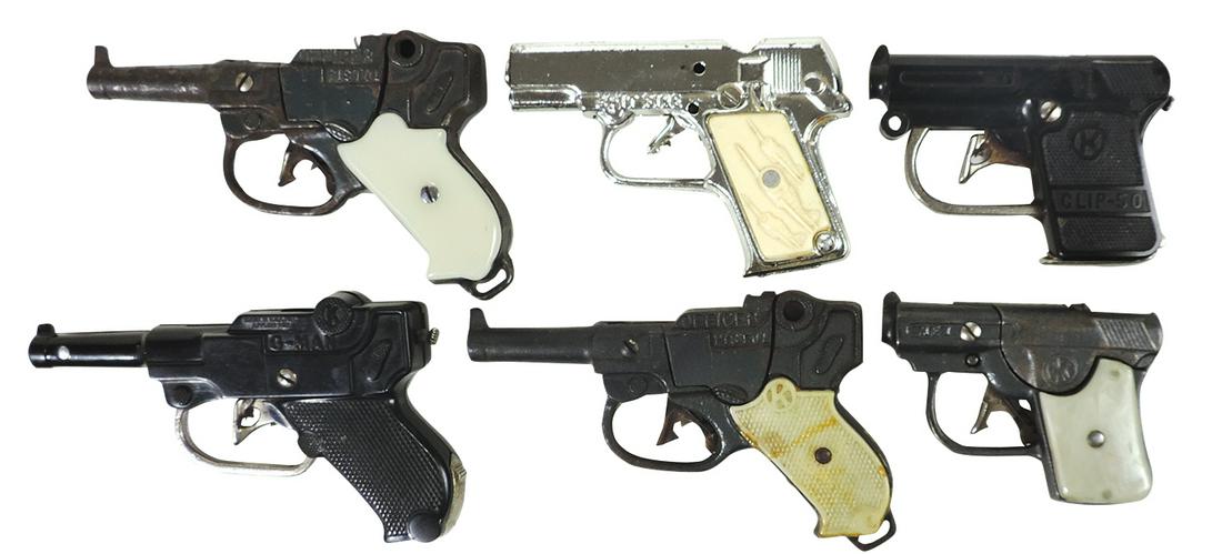 Toy Cap Guns (6), cast iron, Stevens Spitfire, 2 Kenton Officers & Rex plus plastic Kenton G-Man: Toy Cap Guns (6), cast iron, Stevens Spitfire, 2 Kenton Officers & Rex plus plastic Kenton G-Man & Clip-50, Good+ to Exc cond, largest 6.75"L.