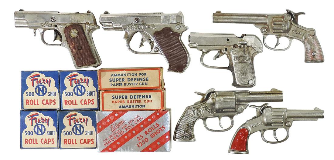 Toy Cap Guns (13), cast iron, Guard, Presto & Champ by Kilgore, 25 Jr., Clip & Hero by Stevens &: Toy Cap Guns (13), cast iron, Guard, Presto & Champ by Kilgore, 25 Jr., Clip & Hero by Stevens & 7 assorted boxes of roll caps, most NOS, Good to Exc cond, largest 7"L.