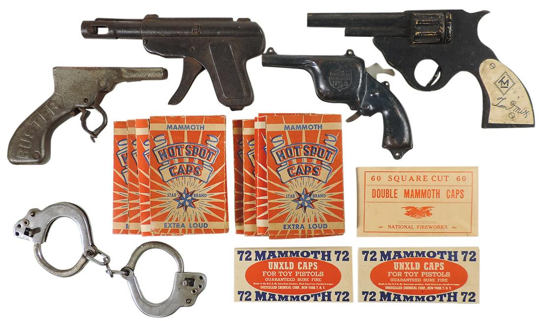 Toy Cap Guns (16), cast iron Buster by Kilgore, wooden Tom Mix, All-Metal Paper Buster, tin bell: Toy Cap Guns (16), cast iron Buster by Kilgore, wooden Tom Mix, All-Metal Paper Buster, tin bell ring pistol, toy handcuffs & 11 packs of Mammoth caps, Good to Exc cond, largest 9"L.
