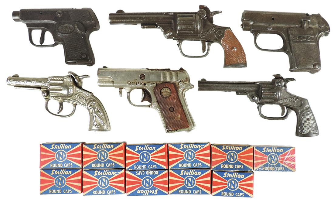 Toy Cap Guns (17), cast iron Hero, Champ, Hunter, Ranger, Sure Shot & 25-50, plus 11 boxes: Toy Cap Guns (17), cast iron Hero, Champ, Hunter, Ranger, Sure Shot & 25-50, plus 11 boxes Stallion round caps, VG to Exc working cond, largest 6.5"L.