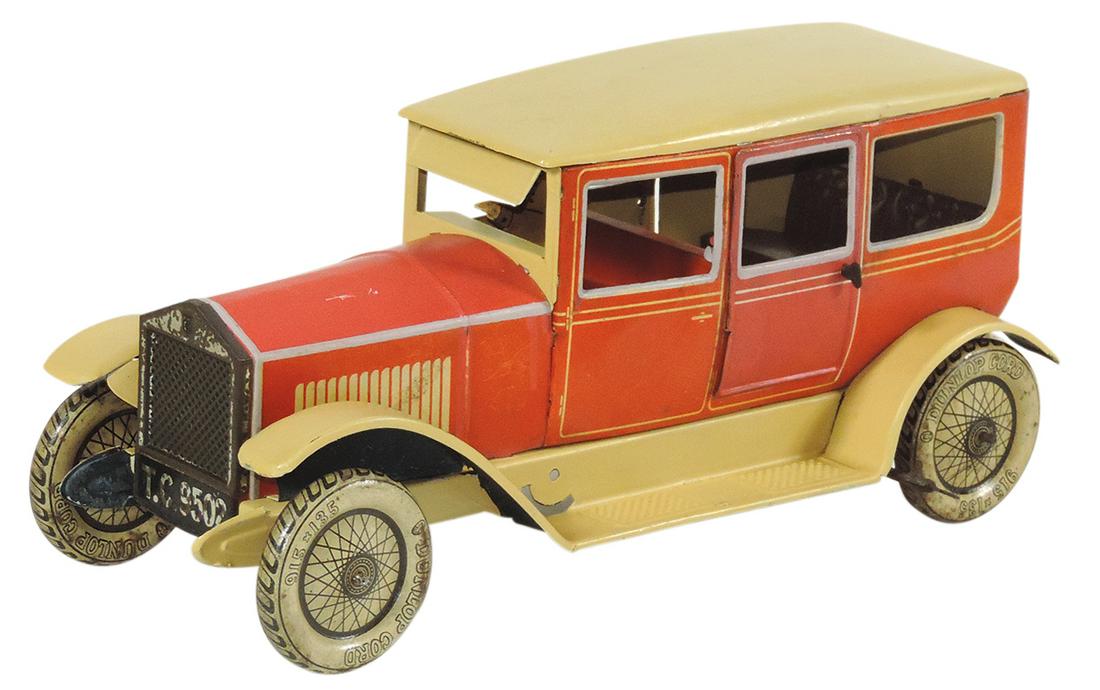Toy Sedan, Karl Bub, metal windup w/metal tires marked Dunlap Cord 915 x 135, c.1930, Exc cond: Toy Sedan, Karl Bub, metal windup w/metal tires marked Dunlap Cord 915 x 135, c.1930, Exc cond w/signs of use, 6.5"H x 13"L.