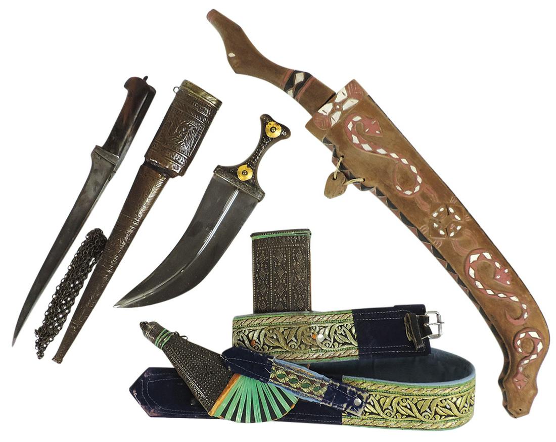 Edged Weapons (3), machete w/carved wood sheath, bone handled Kris w/repousse brass sheath & Persian: Edged Weapons (3), machete w/carved wood sheath, bone handled Kris w/repousse brass sheath & Persian curved dagger w/silvered overlaid sheath & embroidered belt, VG+ to Exc cond, largest 27"L.